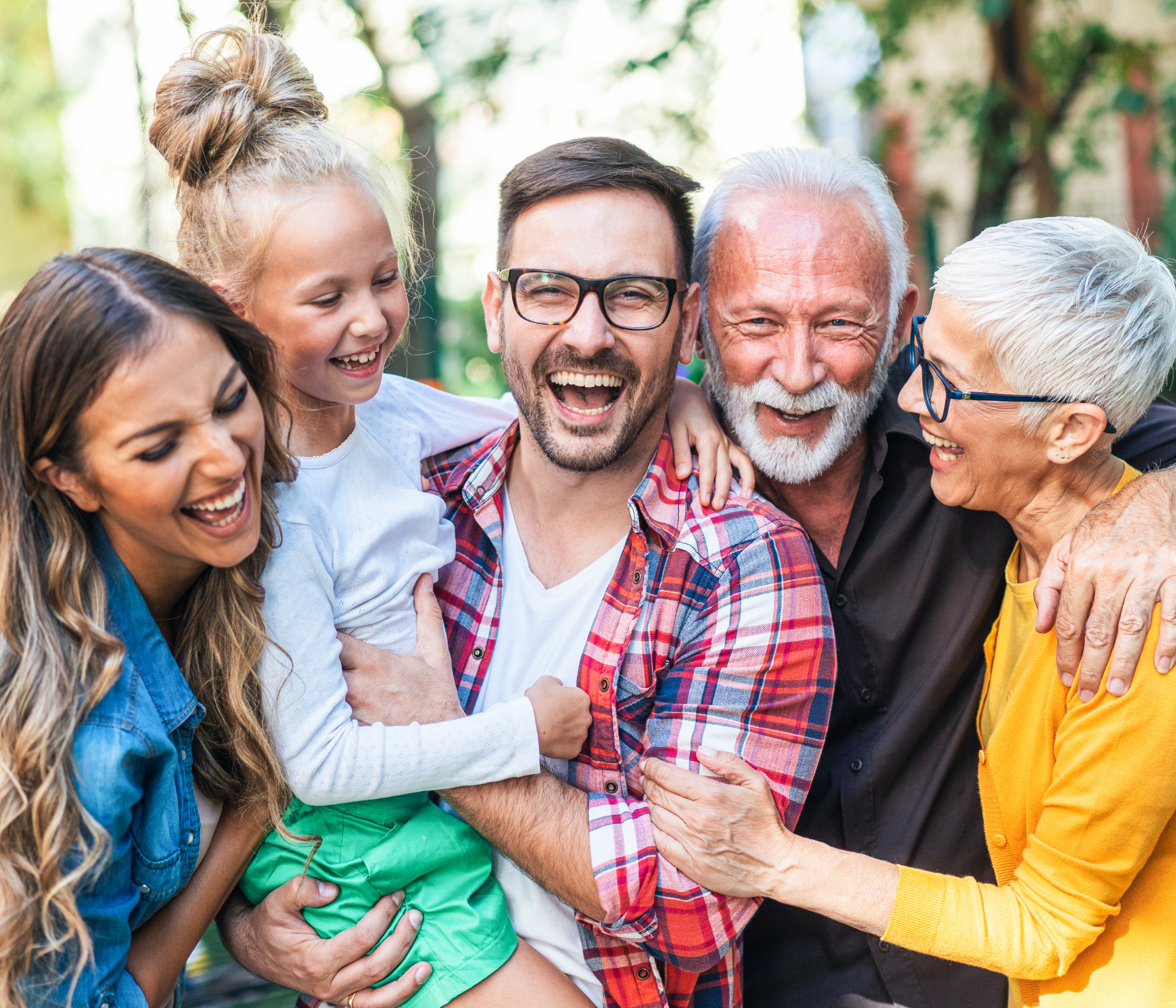 Multigenerational family laughing together in HOA community